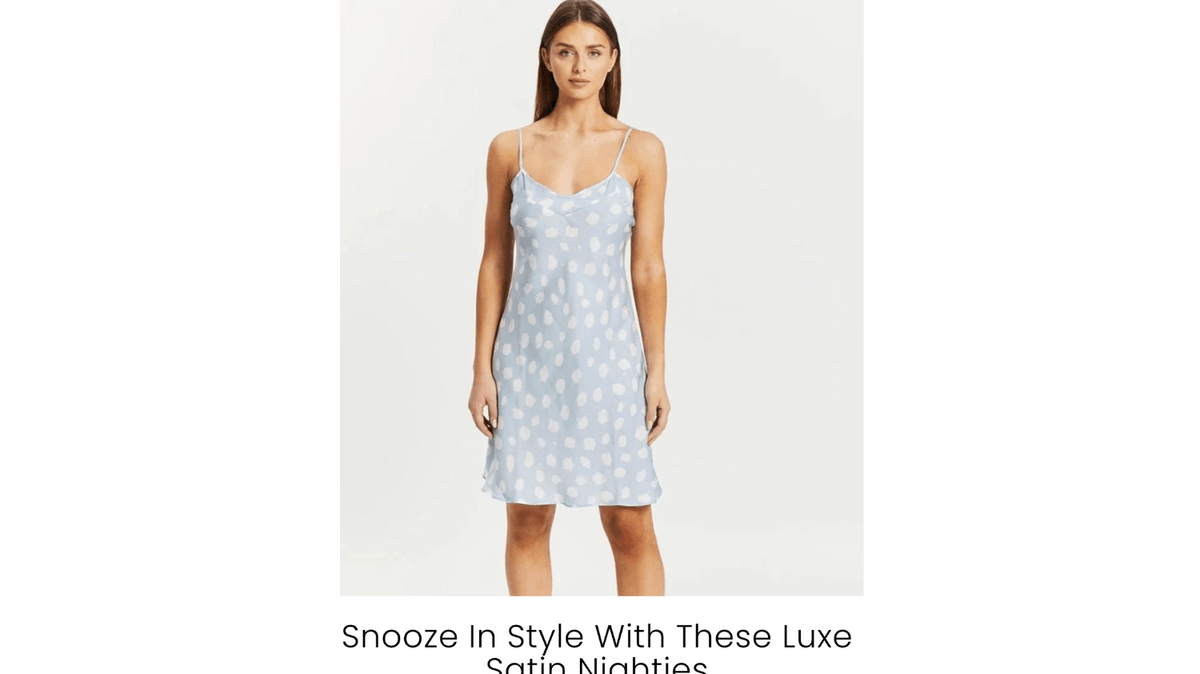 Woman wearing a blue satin nightie with white polka dots from Gingerlilly Sleepwear