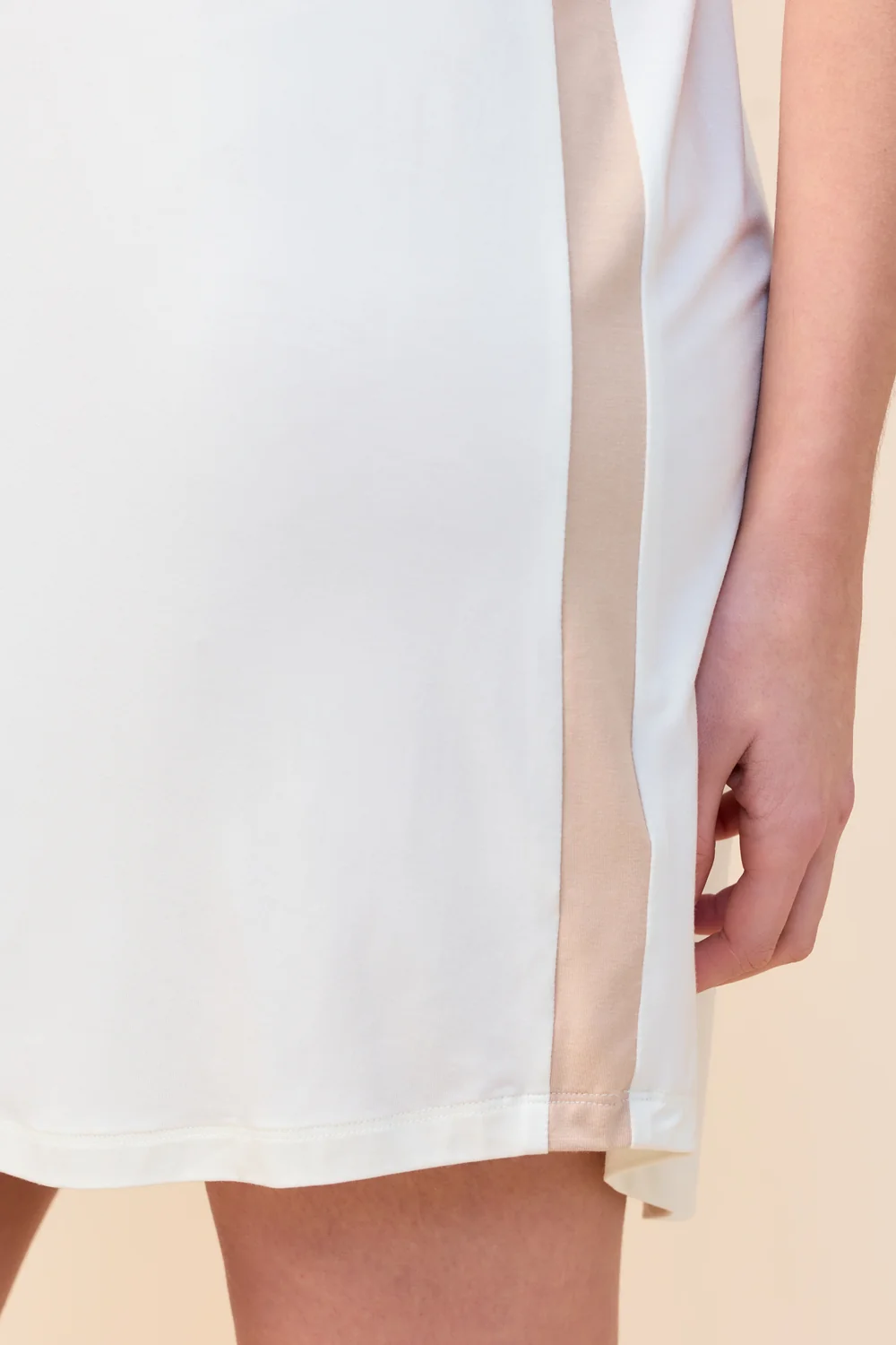 Close-up of the Ashley Bamboo Sleep Tee in Ecru, showing the contrast side stripe at the hem