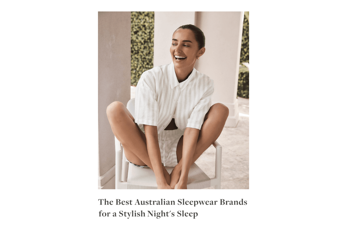 Smiling woman wearing Gingerlilly Sleepwear white striped shirt and shorts outdoors