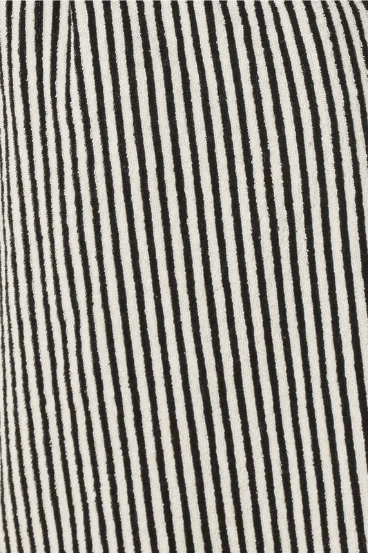 Close-up of black and white striped fabric texture striped adriana terry towel robe