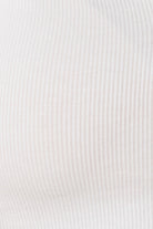 Close up of Athens Ribbed Long Pants Ivory ribbed fabric texture showing soft stretch knit