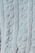 Close-up of textured light blue fabric with cable knit of the Gabriella Plush Long Robe
