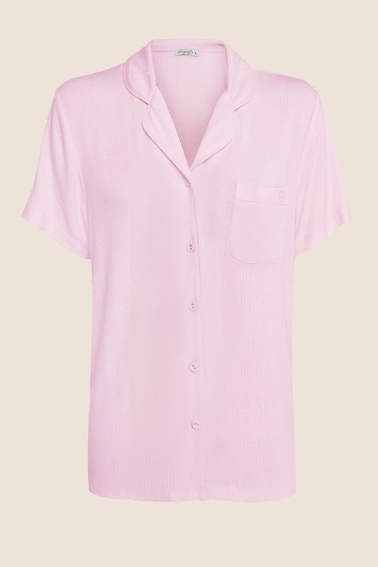 Light pink short-sleeve button-up sleep shirt by Gingerlilly Sleepwear on beige background