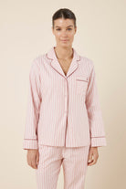 Woman wearing Octavia Cotton Stripe PJ Set Pink, relaxed fit button through cotton shirt with chest pocket