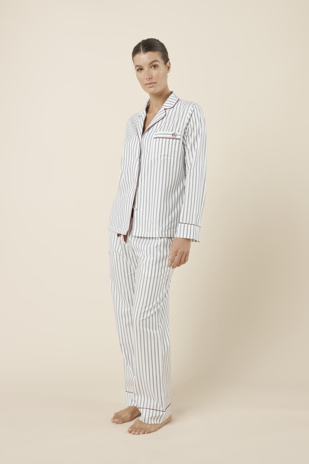 Woman wearing the Octavia Cotton Stripe PJ Set on model featuring contrast piping, chest pocket and breathable cotton fabric side view