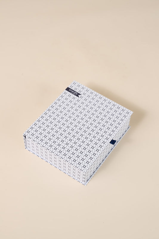 Gingerlilly Sleepwear gift box with blue geometric pattern on beige background