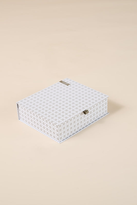 Patterned white gift box for Gingerlilly Sleepwear on beige background