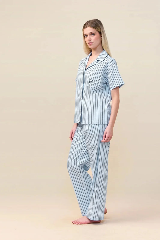 Woman wearing the Lisa Stripe Long Pant PJ Set in Blue, angled front view