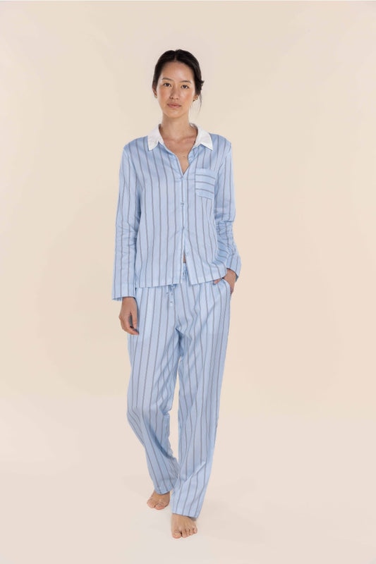 Woman wearing Gingerlilly Sleepwear blue striped cotton pajamas, front view, barefoot