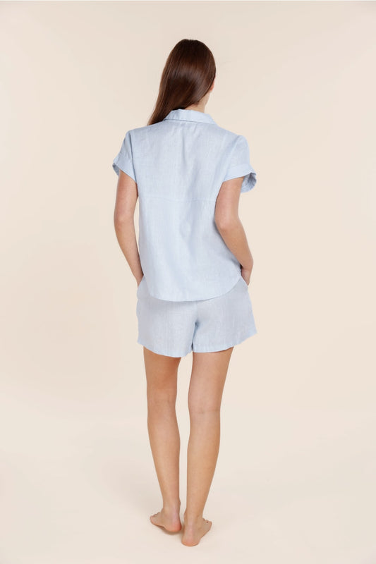 Woman wearing light blue Gingerlilly Sleepwear cotton pajamas, back view