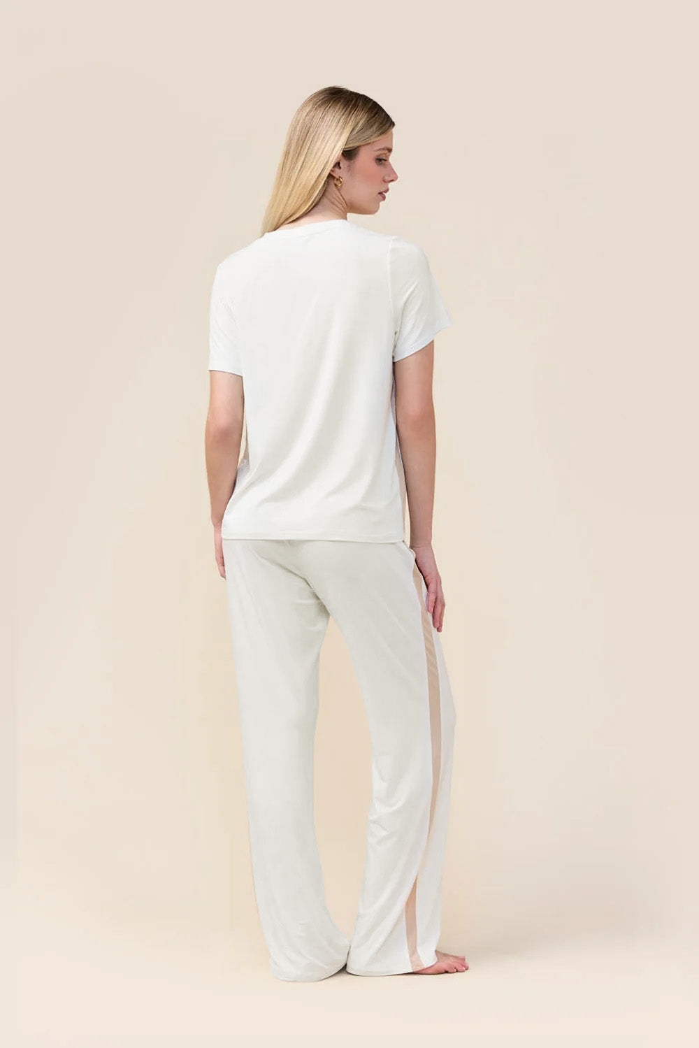 Woman wearing the Bronte Bamboo T-Shirt with Stripe in Ecru, back view