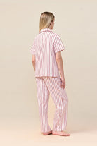 Woman wearing the Lisa Stripe Long Pant PJ Set in Pink, back view