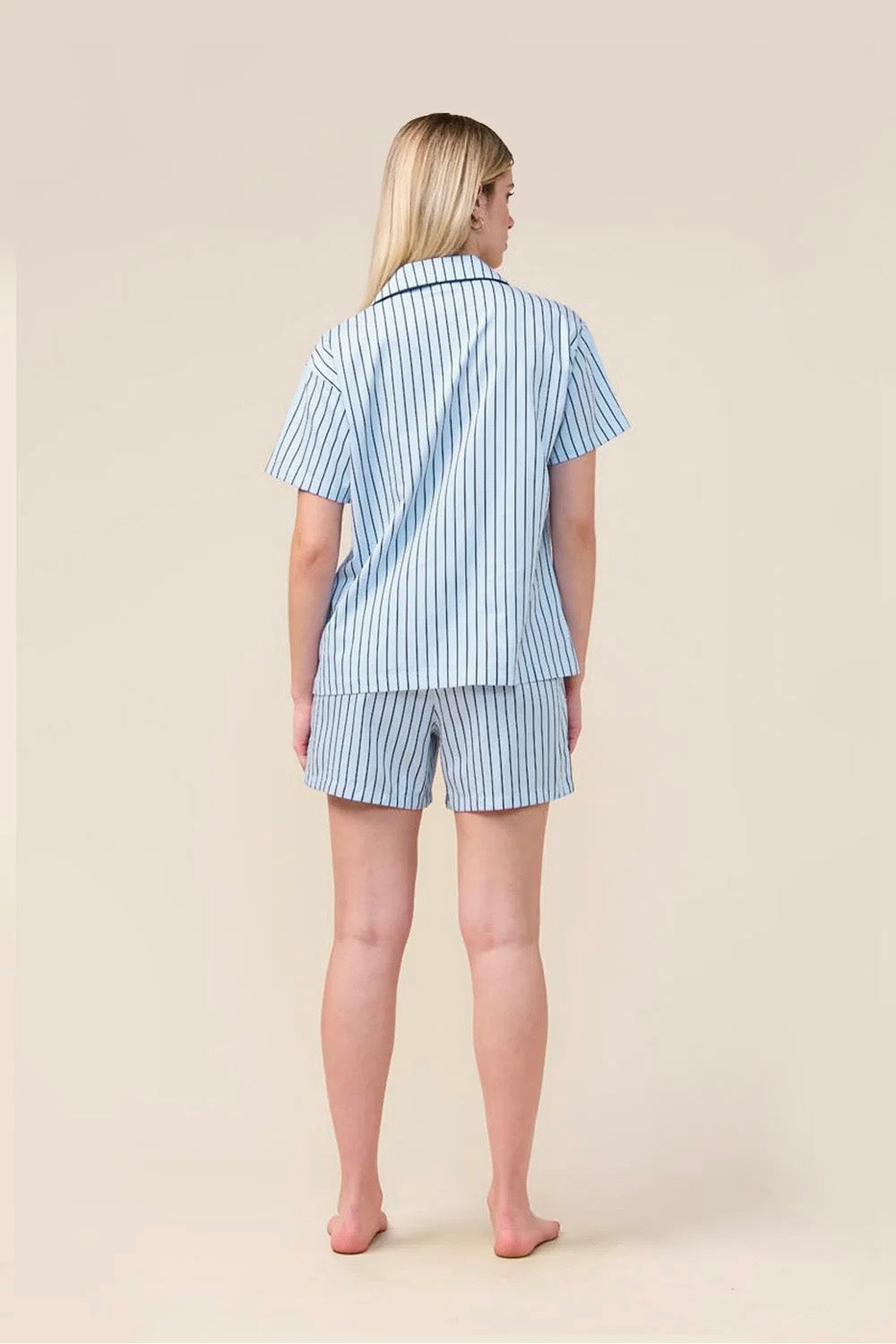 Woman wearing the Poppy Stripe Short PJ Set in Blue, back view