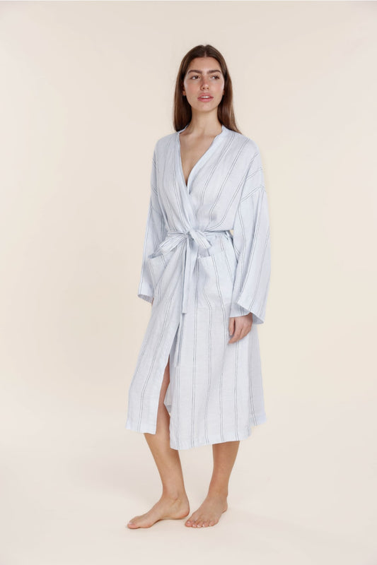 Woman wearing Gingerlilly Sleepwear blue striped cotton robe with tie belt, barefoot.